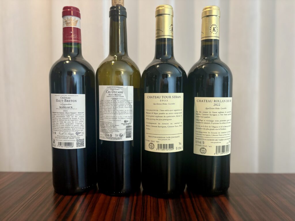 2021 Chateau Haut-Breton Larigaudiere, Margaux; 2012 Chateau Cru Ducasse, Haut Medoc; 2022 Chateau Tour Seran, Medoc; 2022 Chateau Rollan de By, Medoc; (back labels)